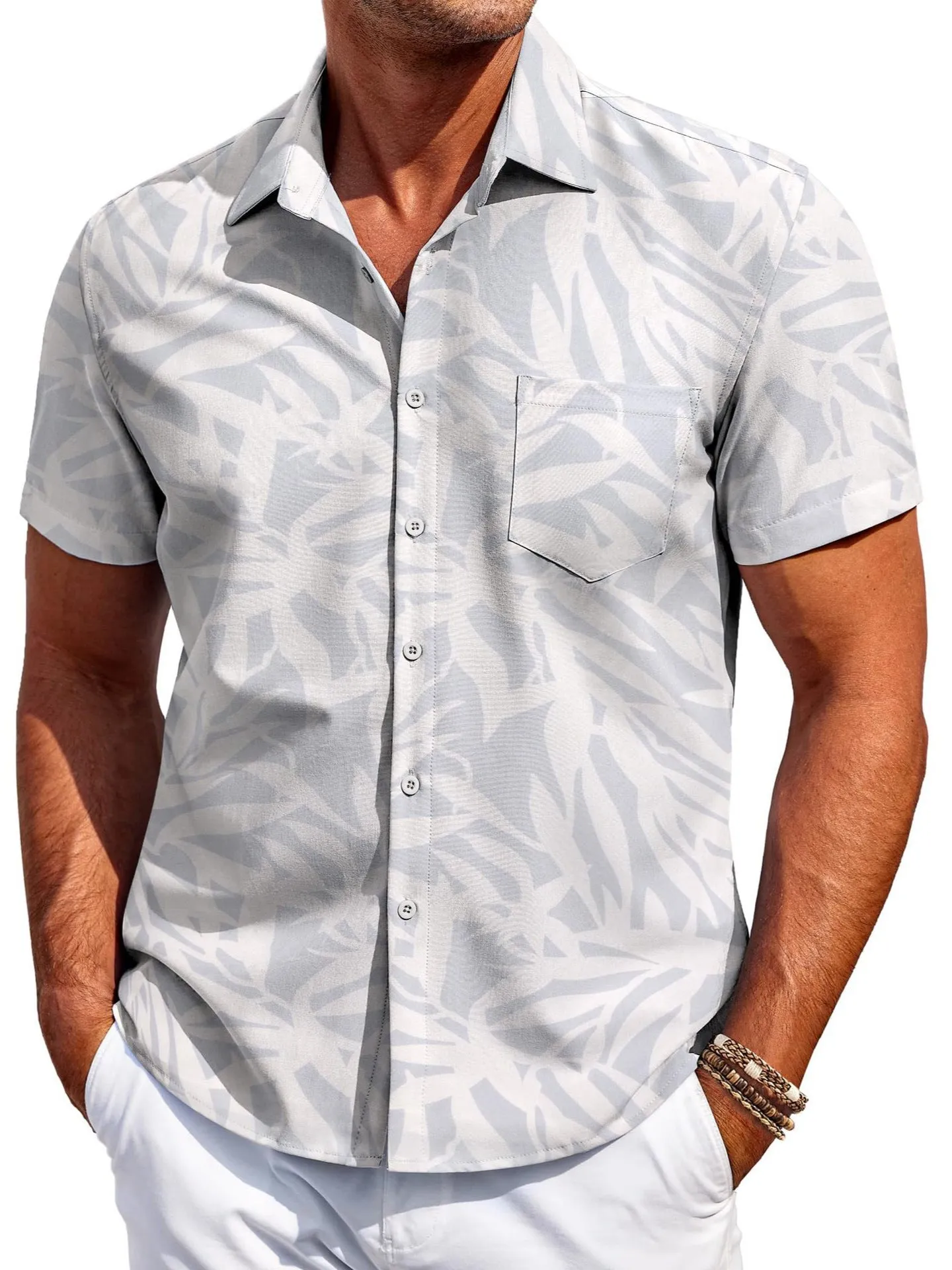 Man wearing a slim fit, short sleeve Hawaiian shirt in a colour choice from the available range.