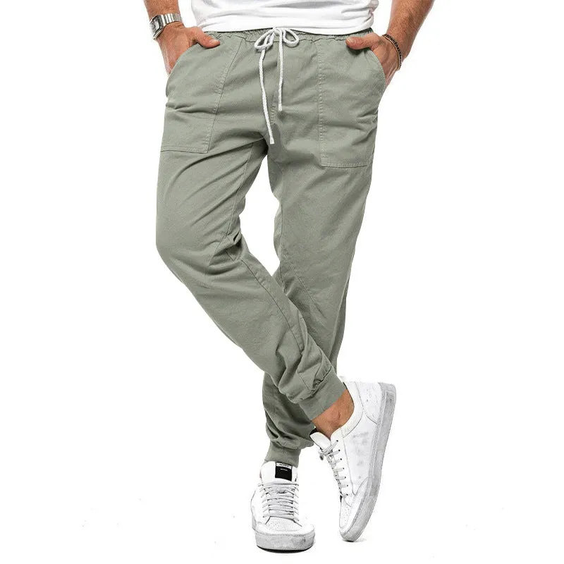 Men's loose tapered casual trousers with drawstring waist and ankle bands in solid colour