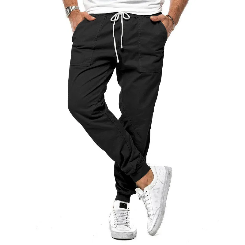 Men's loose tapered casual trousers with drawstring waist and ankle bands in solid colour