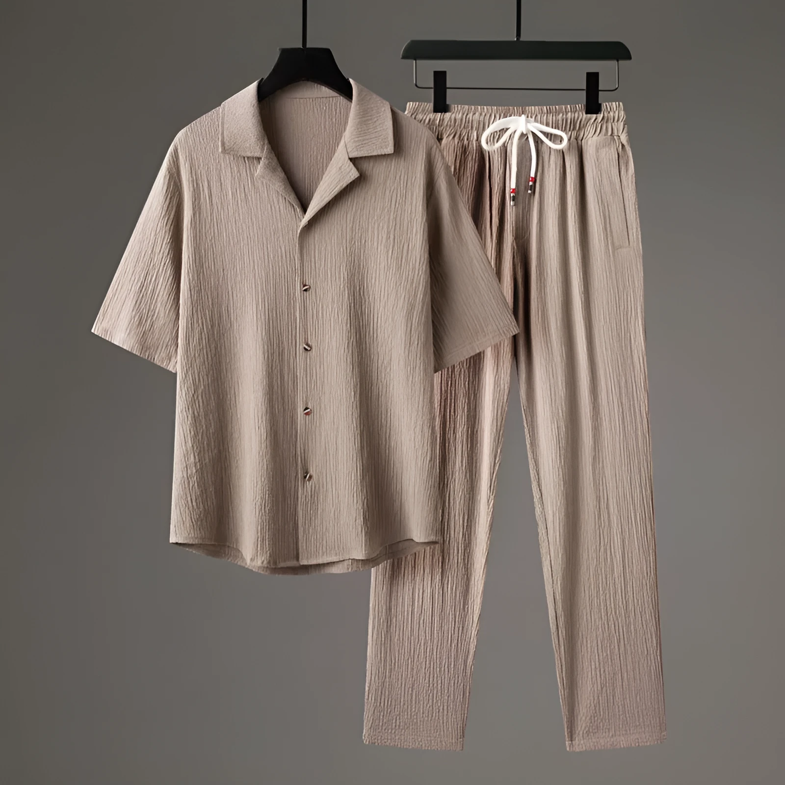 Men's grey Chinese-style casual two-piece sportswear set with short sleeve top and trousers on a hanger.