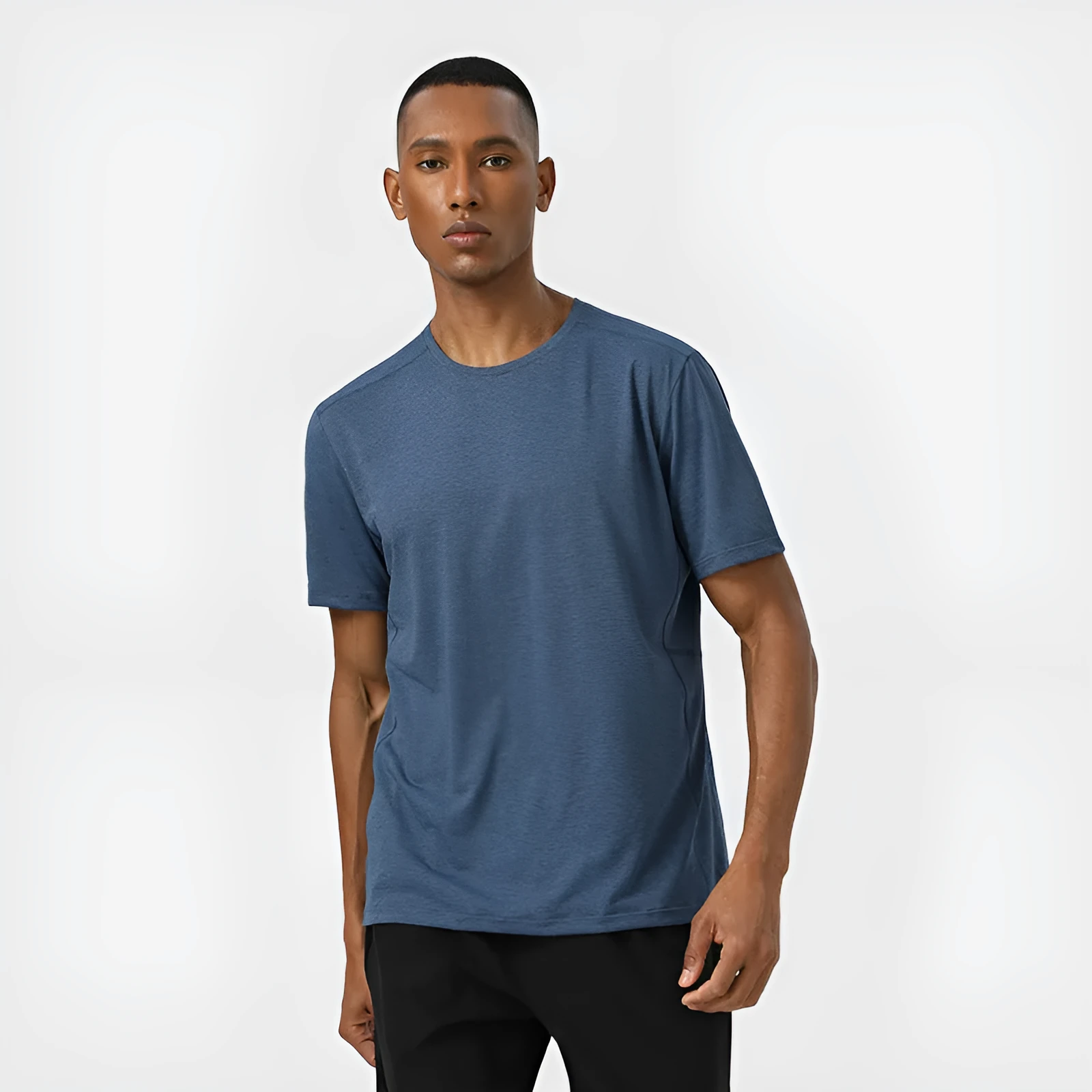 Man wearing a light grey quick-dry polyester short sleeve sport shirt with reflective details.