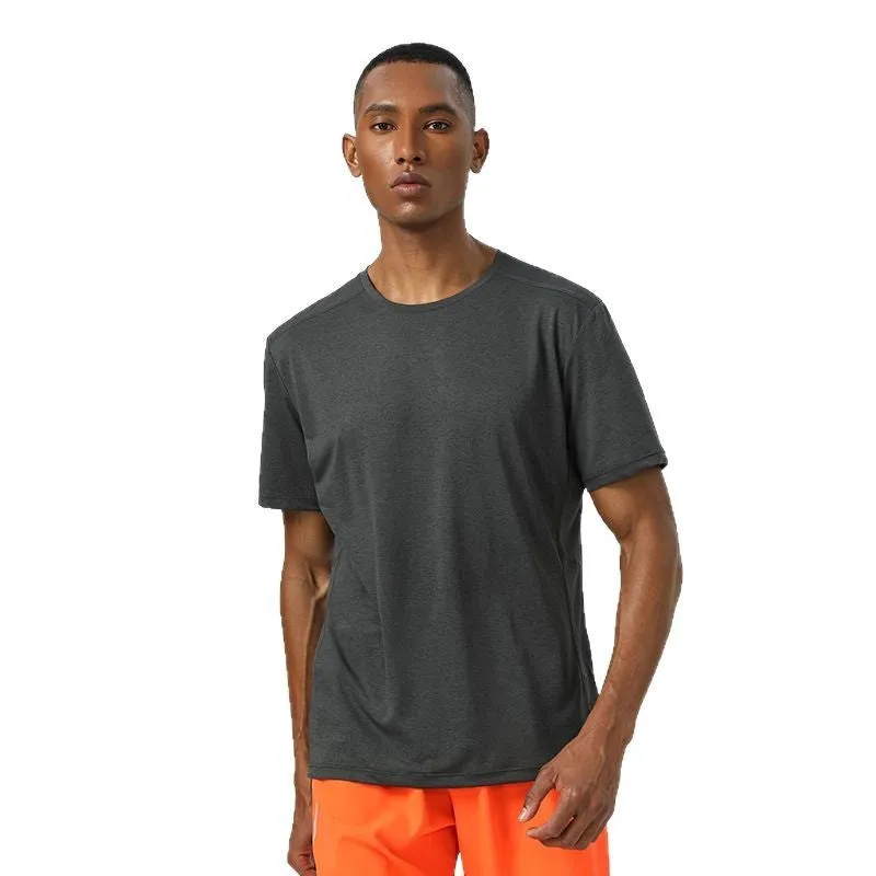 Man wearing a light grey quick-dry polyester short sleeve sport shirt with reflective details.