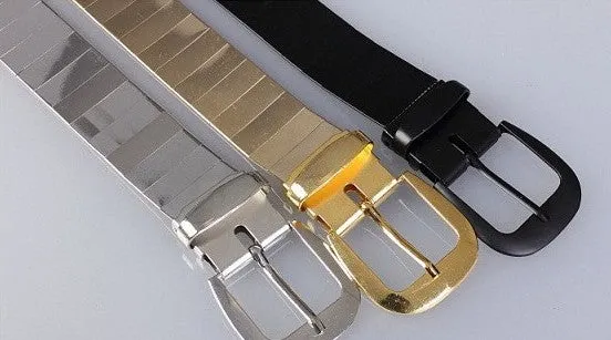 Three shiny belts in gold, silver, and black metallic finish arranged together
