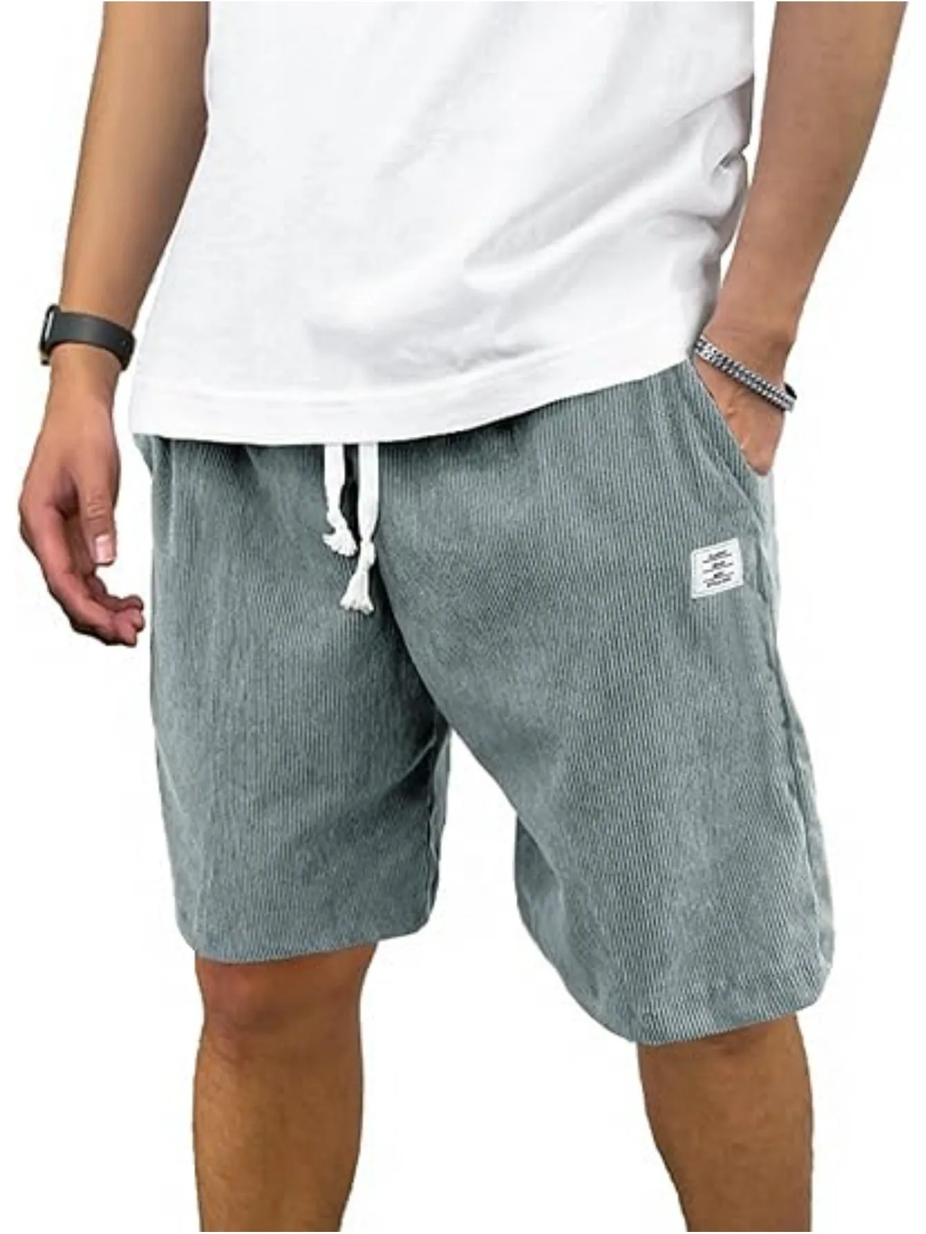 Men's straight-leg corduroy sports shorts in army green colour, showing texture and fit.