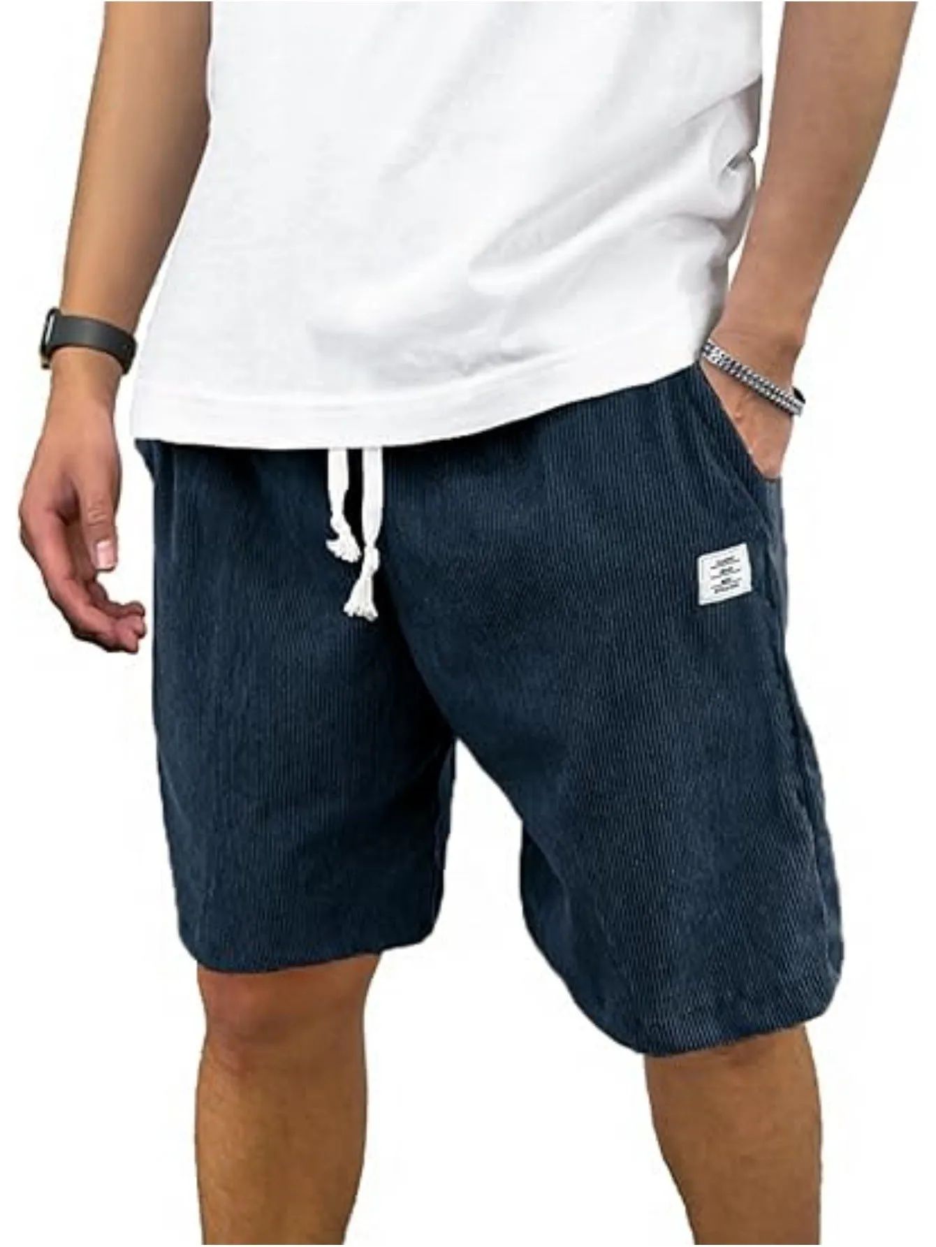 Men's straight-leg corduroy sports shorts in army green colour, showing texture and fit.