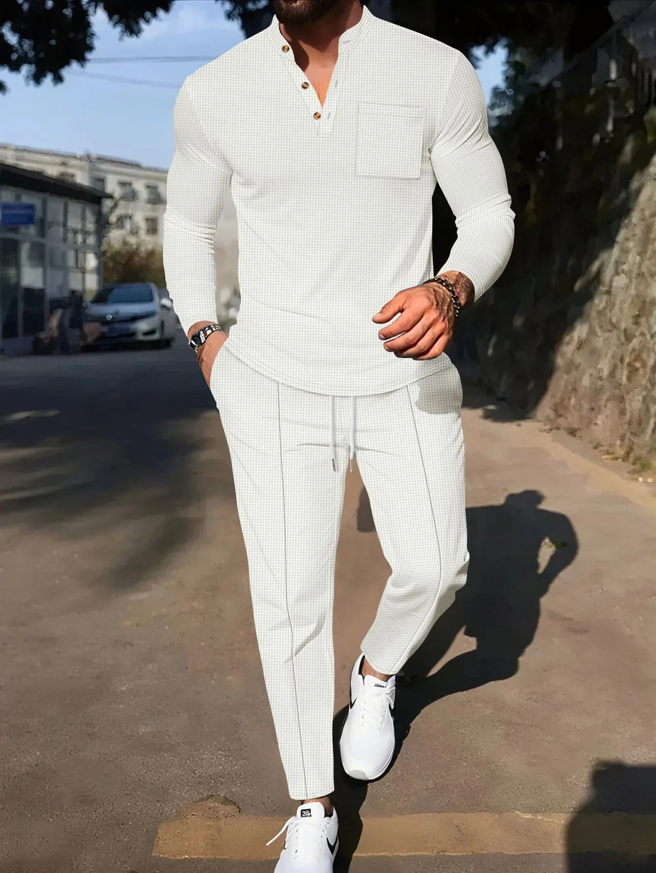 Men's waffle henley long sleeve t-shirt and matching long pants casual set in gray on a model