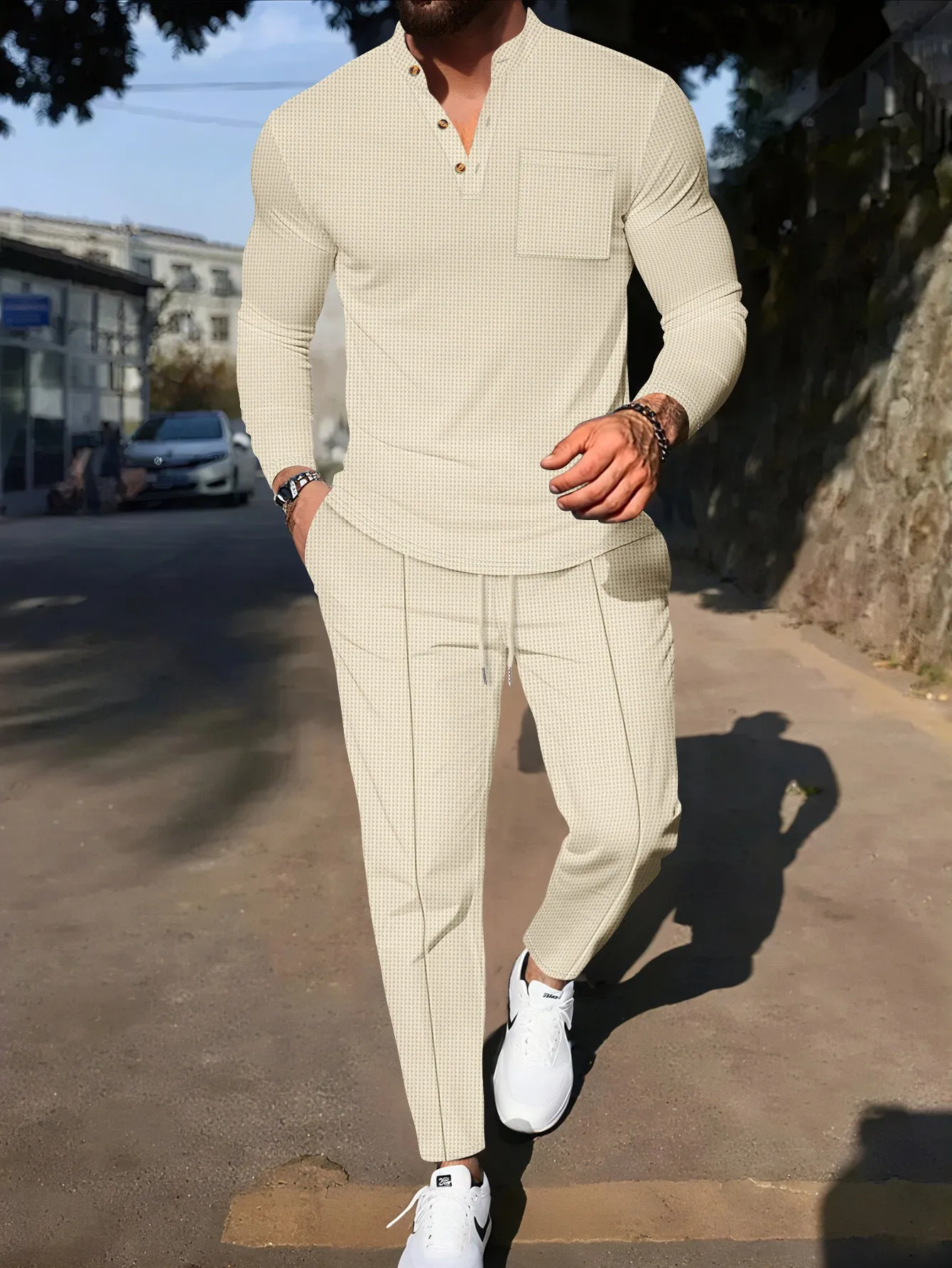 Men's waffle henley long sleeve t-shirt and matching long pants casual set in gray on a model