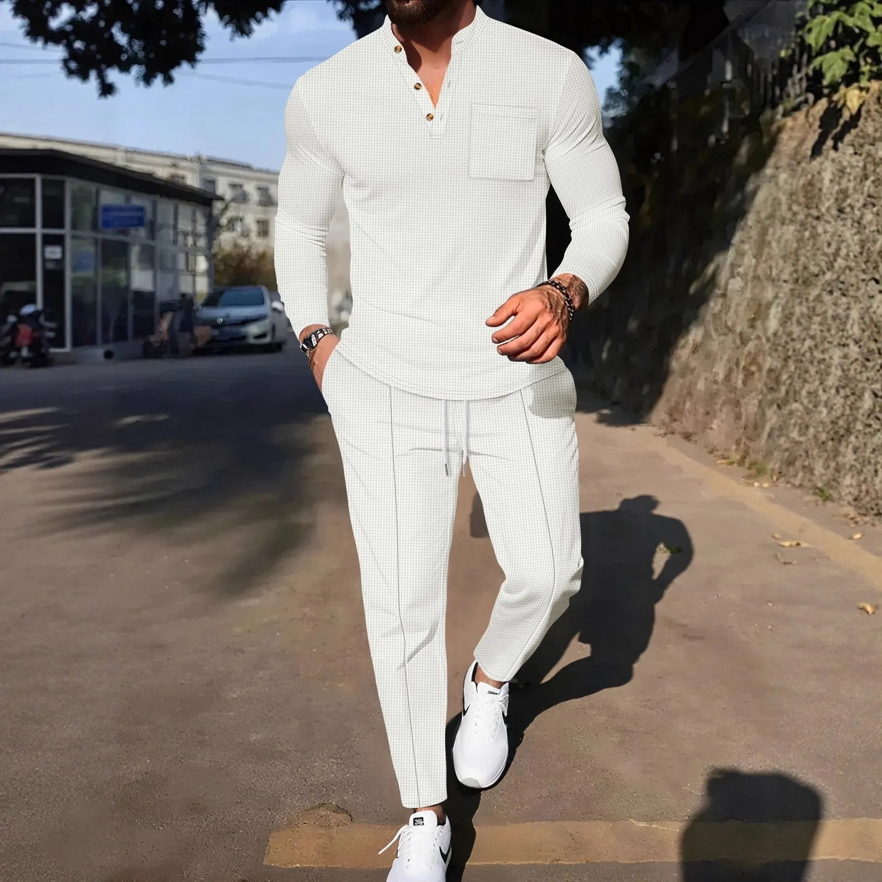 Men's waffle henley long sleeve t-shirt and matching long pants casual set in gray on a model