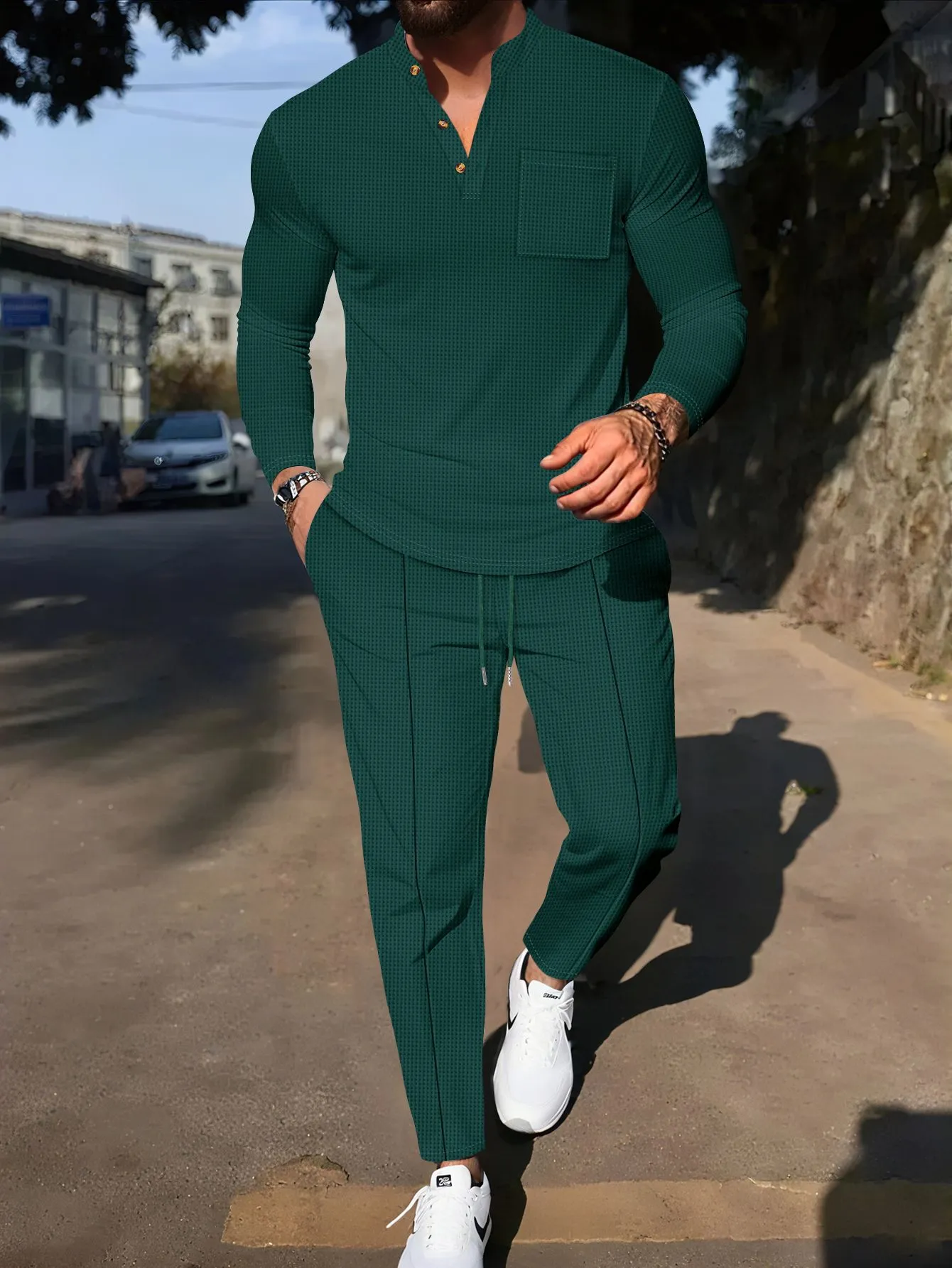 Men's waffle henley long sleeve t-shirt and matching long pants casual set in gray on a model