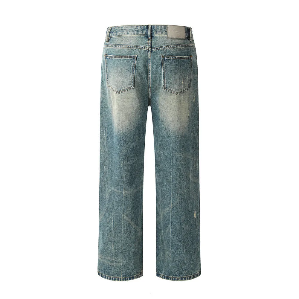 Retro distressed jeans for men in vintage blue cotton denim with worn-in finish, front view