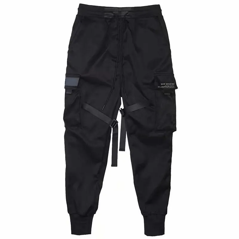 Men's black cotton harem joggers with side pockets and elastic waist, shown with drawstring and Velcro closures