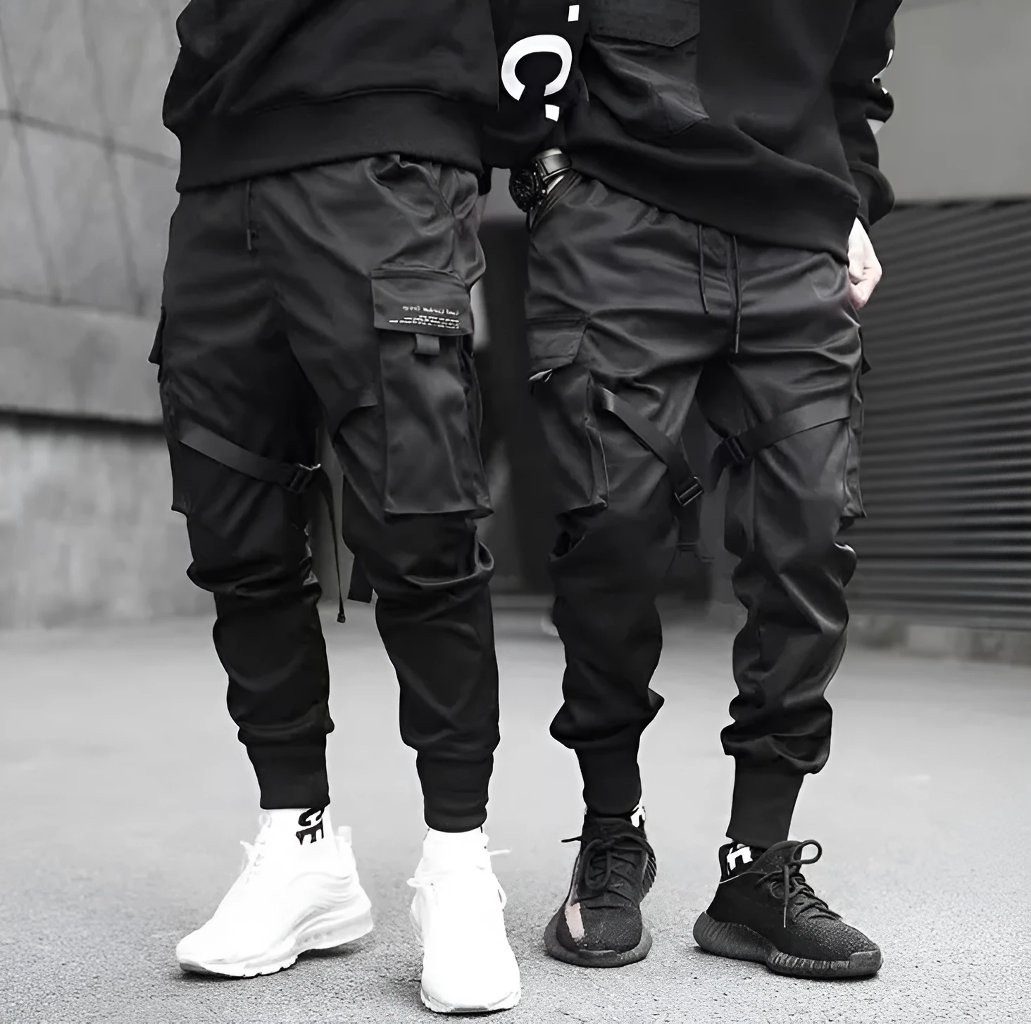 Men's black cotton harem joggers with side pockets and elastic waist, shown with drawstring and Velcro closures
