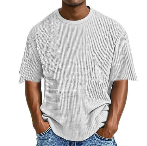 Man wearing a light blue cotton blend waffle knit short sleeve casual T-shirt.