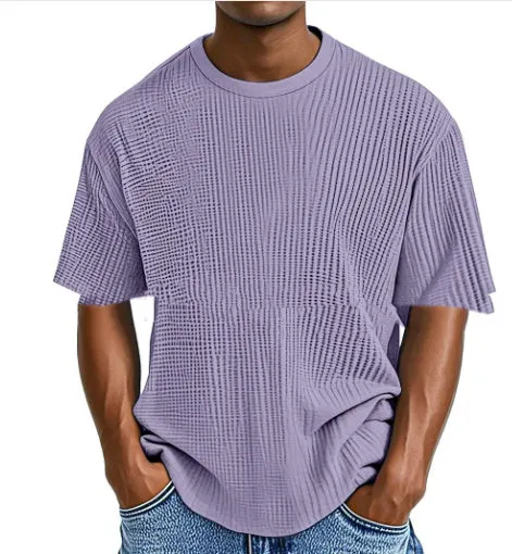 Man wearing a light blue cotton blend waffle knit short sleeve casual T-shirt.