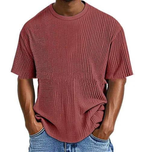 Man wearing a light blue cotton blend waffle knit short sleeve casual T-shirt.