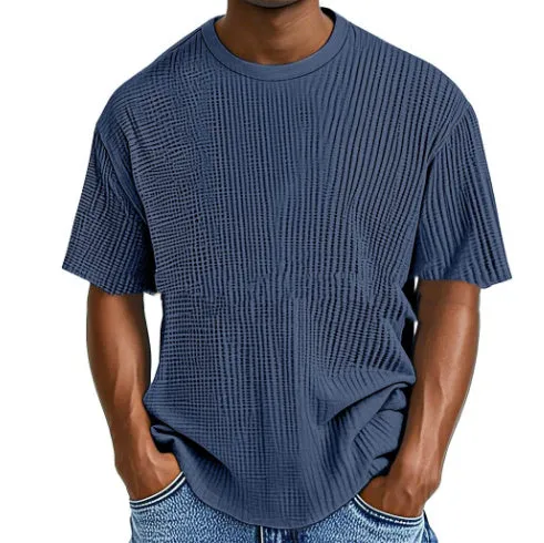 Man wearing a light blue cotton blend waffle knit short sleeve casual T-shirt.