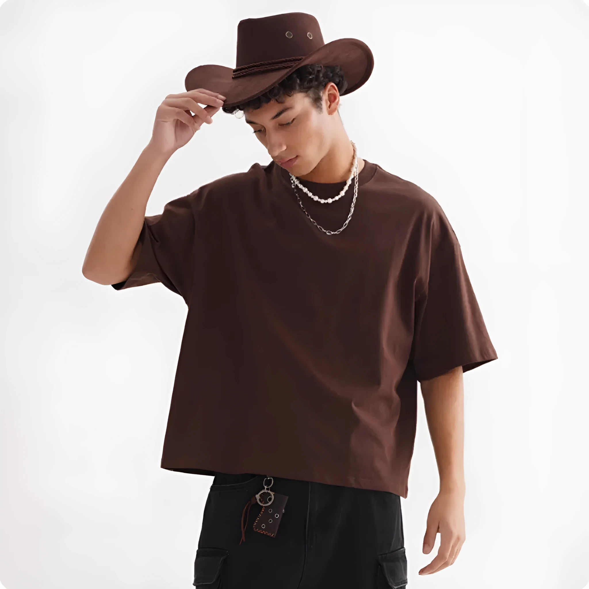 Pure cotton American-style loose fit T-shirt shown in apricot colour on a hanger.