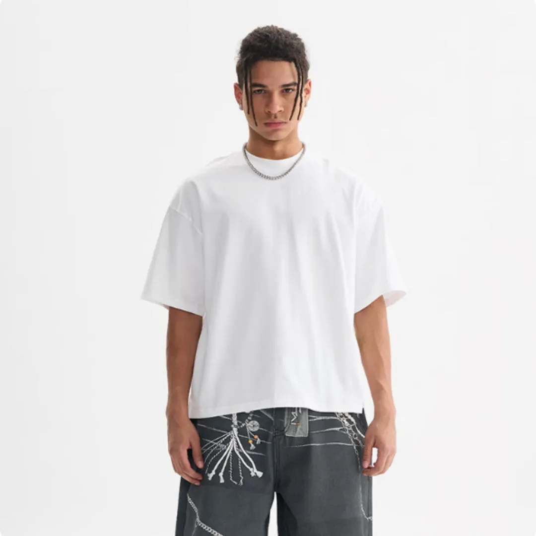 Pure cotton American-style loose fit T-shirt shown in apricot colour on a hanger.