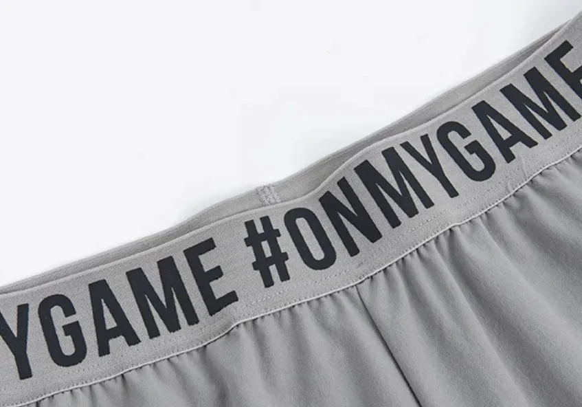 Loose cropped sports trousers in grey with printed waistband, moisture-wicking fabric for women