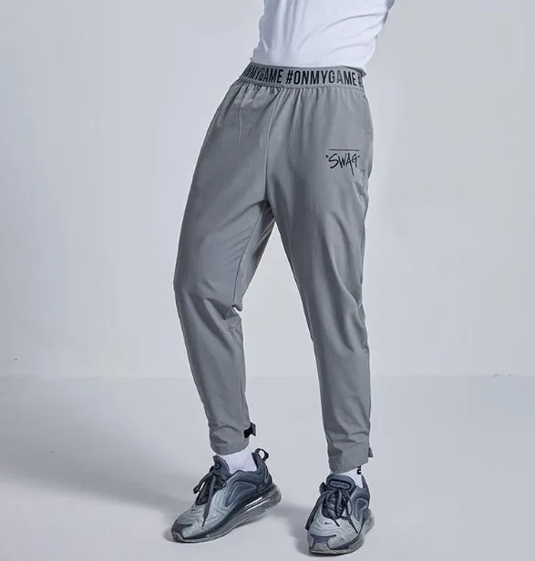 Loose cropped sports trousers in grey with printed waistband, moisture-wicking fabric for women
