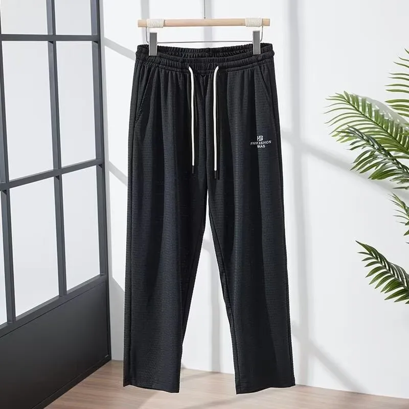Men's thin grey ice silk casual trousers with a loose straight-leg fit and ankle-tied detail.