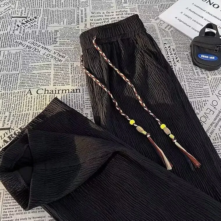 Korean style men's summer pants in black with drooping texture and folding craft detailing