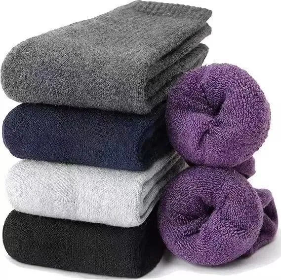 A pair of solid colour wool cashmere blend tube socks with a mid-calf length on a neutral background.