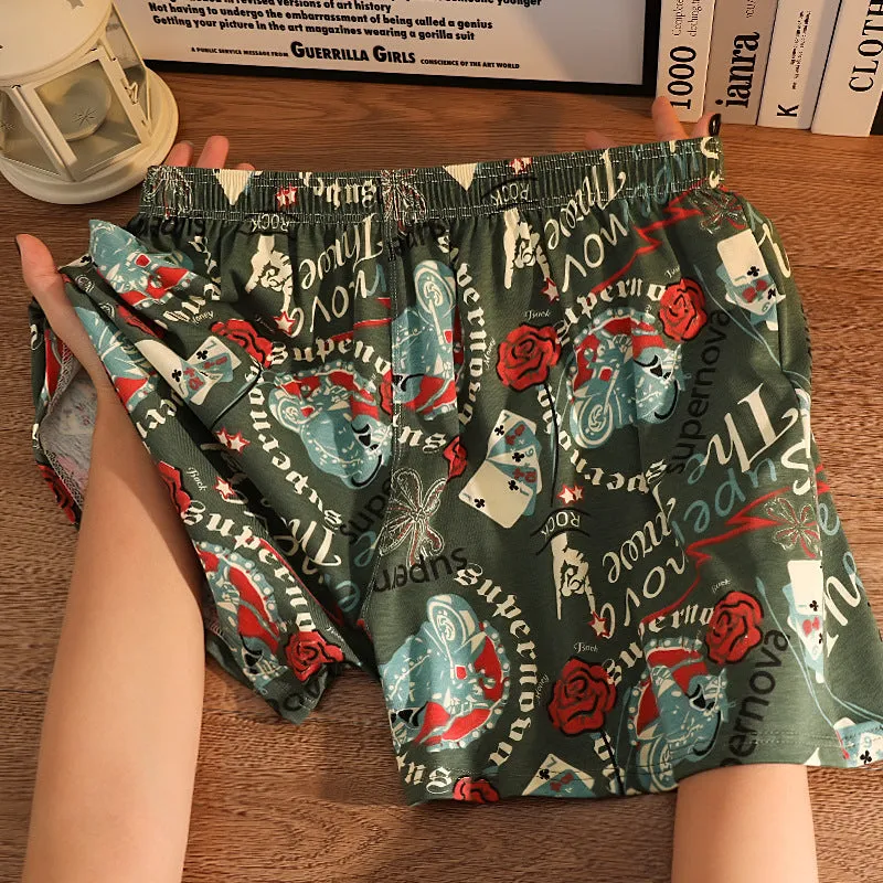 Men's grey printed cotton boxer shorts with a loose, casual fit and mid-waist design.