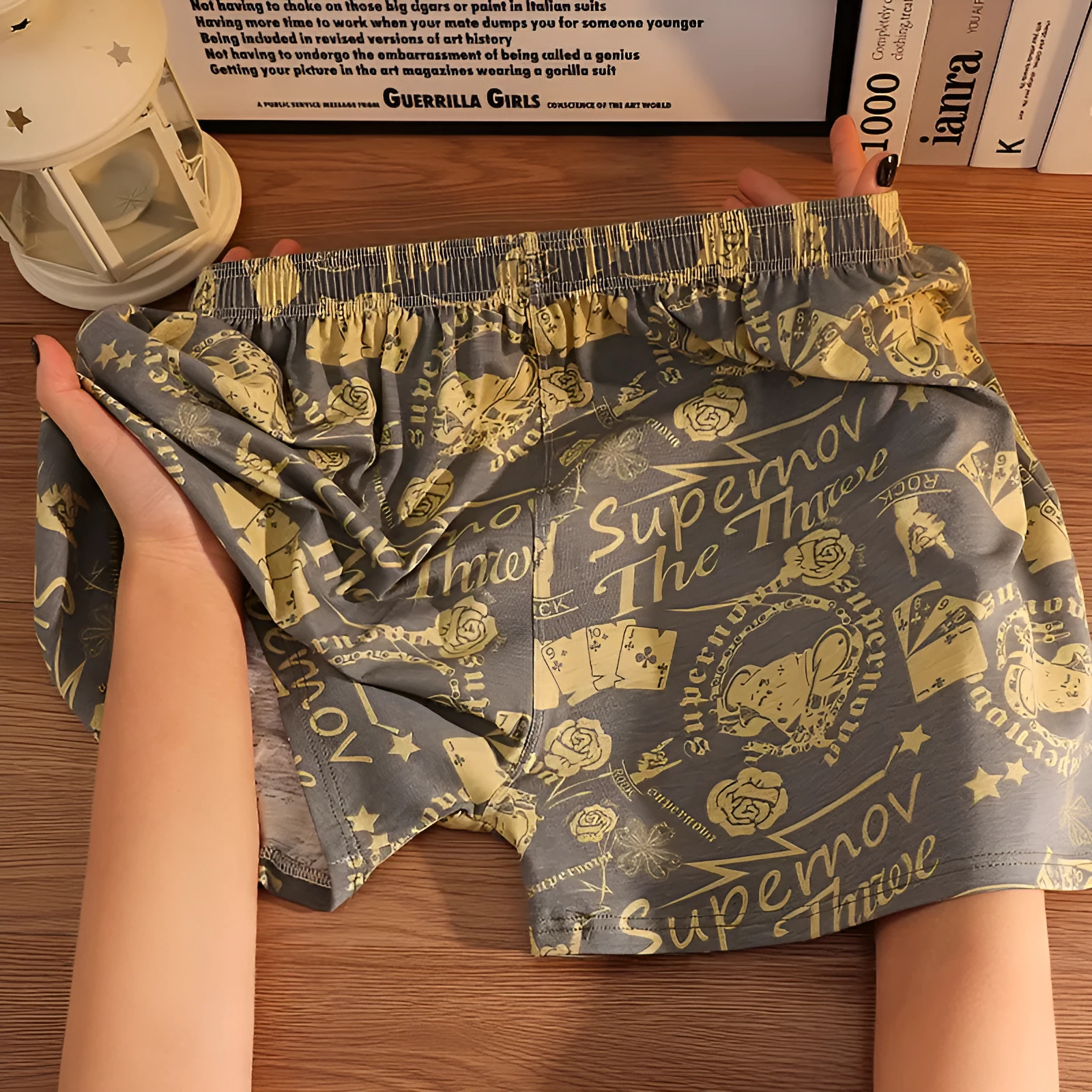 Men's grey printed cotton boxer shorts with a loose, casual fit and mid-waist design.