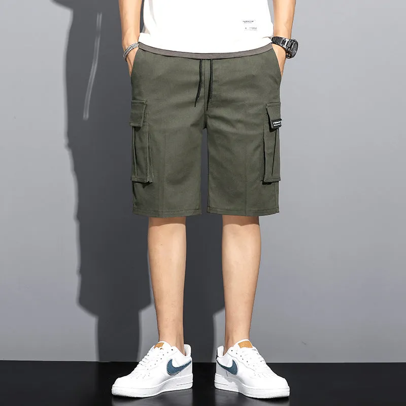Men's camouflage 5-point workwear shorts in green, front view, with drawstring waist and mid-thigh length