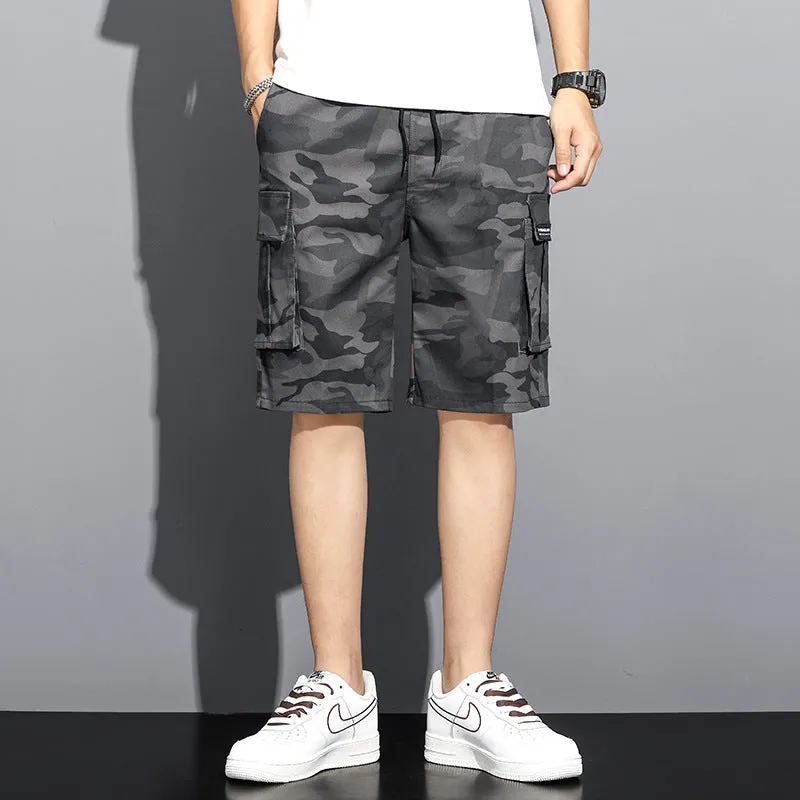 Men's camouflage 5-point workwear shorts in green, front view, with drawstring waist and mid-thigh length