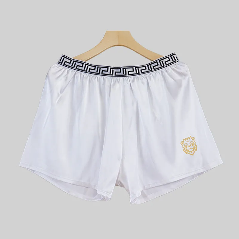 Men's solid colour knitted polyester boxer shorts in black, loose fit mid-waist breathable design, available in sizes L to 4XL