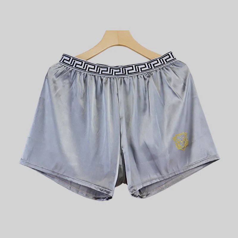 Men's solid colour knitted polyester boxer shorts in black, loose fit mid-waist breathable design, available in sizes L to 4XL