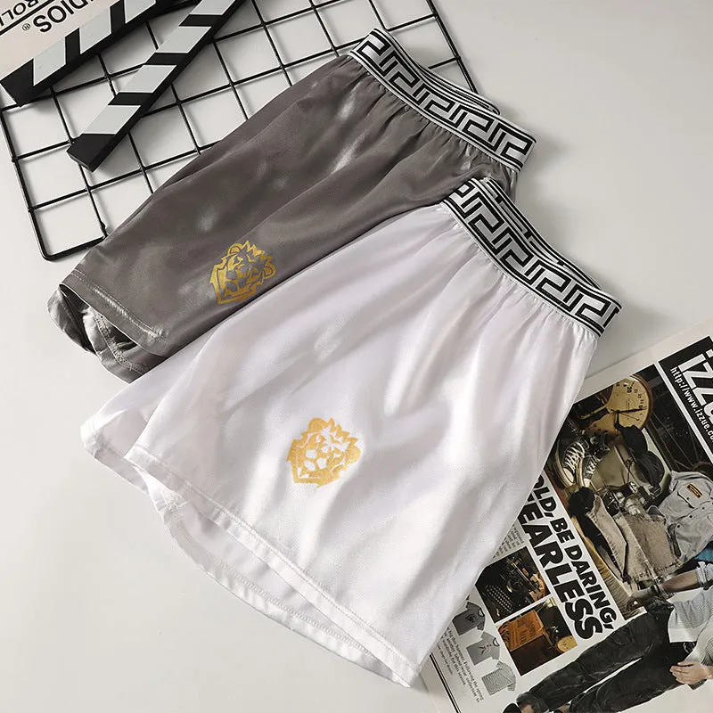 Men's solid colour knitted polyester boxer shorts in black, loose fit mid-waist breathable design, available in sizes L to 4XL
