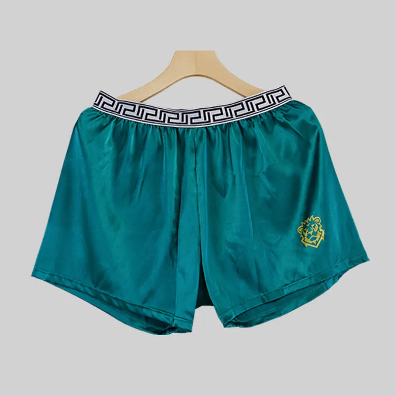 Men's solid colour knitted polyester boxer shorts in black, loose fit mid-waist breathable design, available in sizes L to 4XL