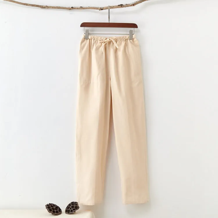 Men's beige pure cotton casual trousers with drawstring waist and belt on a neutral background.