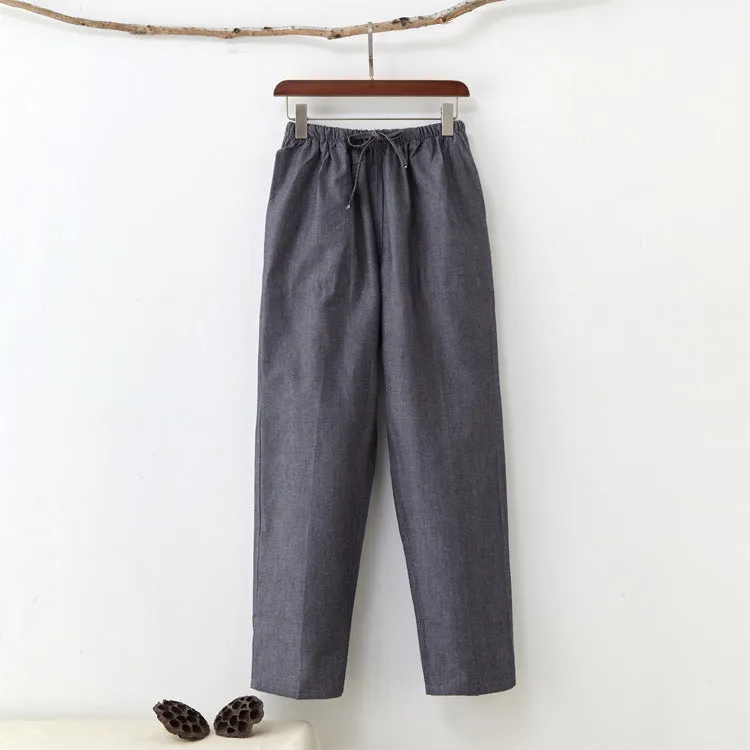 Men's beige pure cotton casual trousers with drawstring waist and belt on a neutral background.