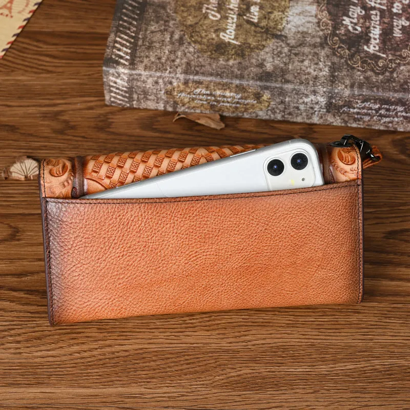 Women's brown tri-fold leather wallet with an embossed floral pattern, shown open to reveal compartments.