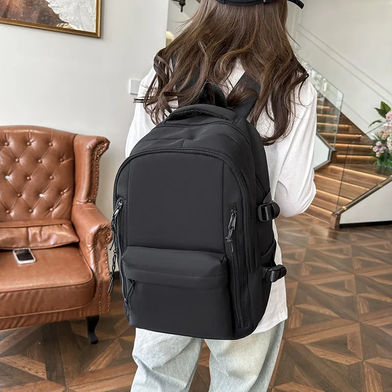 Women's large capacity solid colour schoolbag in black with curved shoulder strap and nylon material