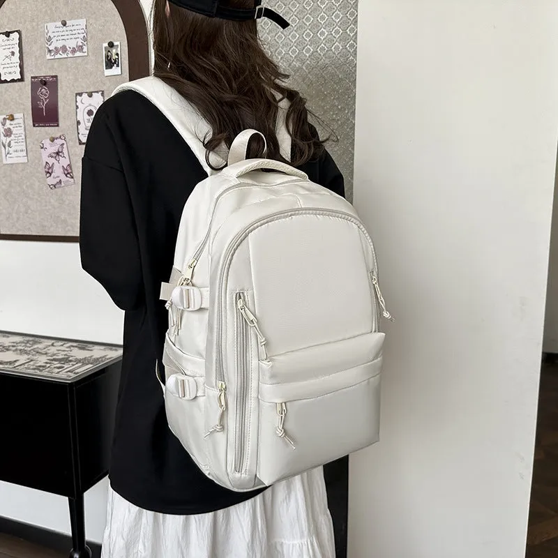 Women's large capacity solid colour schoolbag in black with curved shoulder strap and nylon material