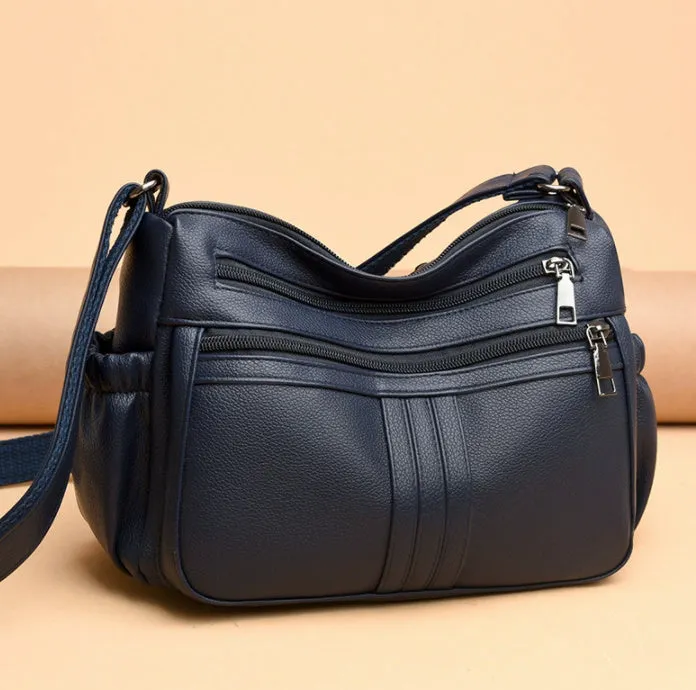 Genuine leather cross-body messenger bag in horizontal square shape with internal organisers
