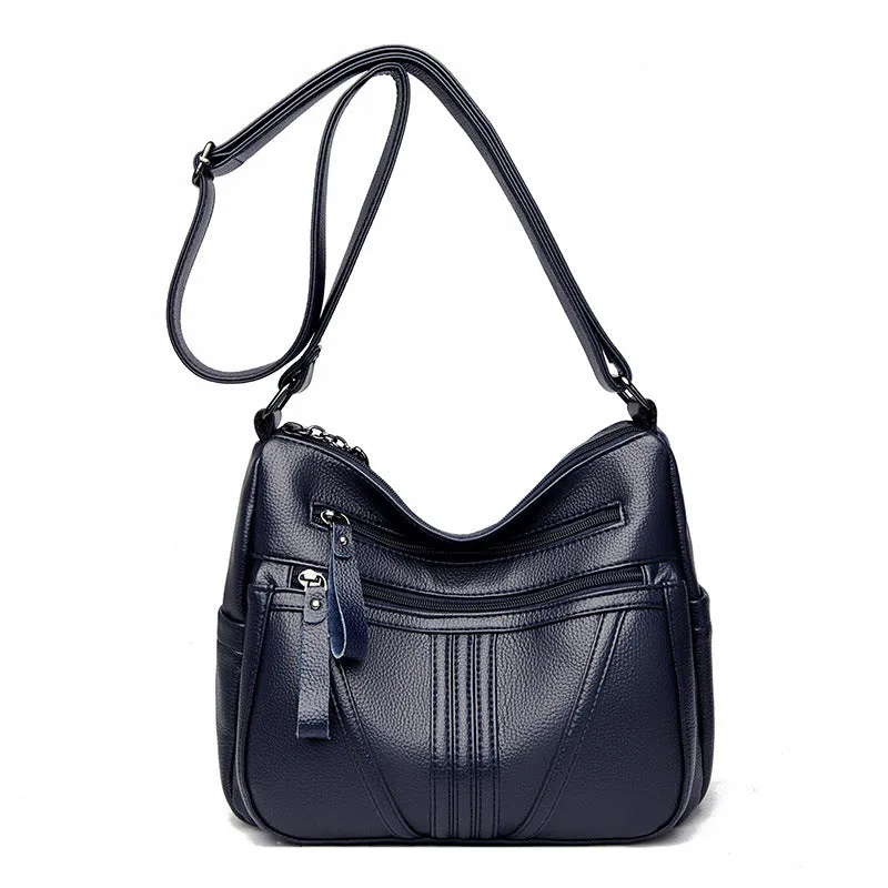 Genuine leather cross-body messenger bag in horizontal square shape with internal organisers