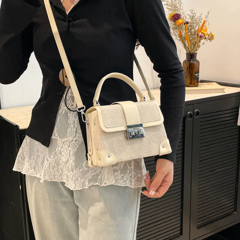 PU leather crossbody bag in horizontal square shape with sewing thread detail, available in seven colours