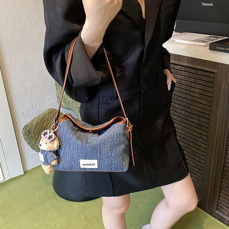 Fashion retro denim small crossbody bag in black with slit pocket and pendant