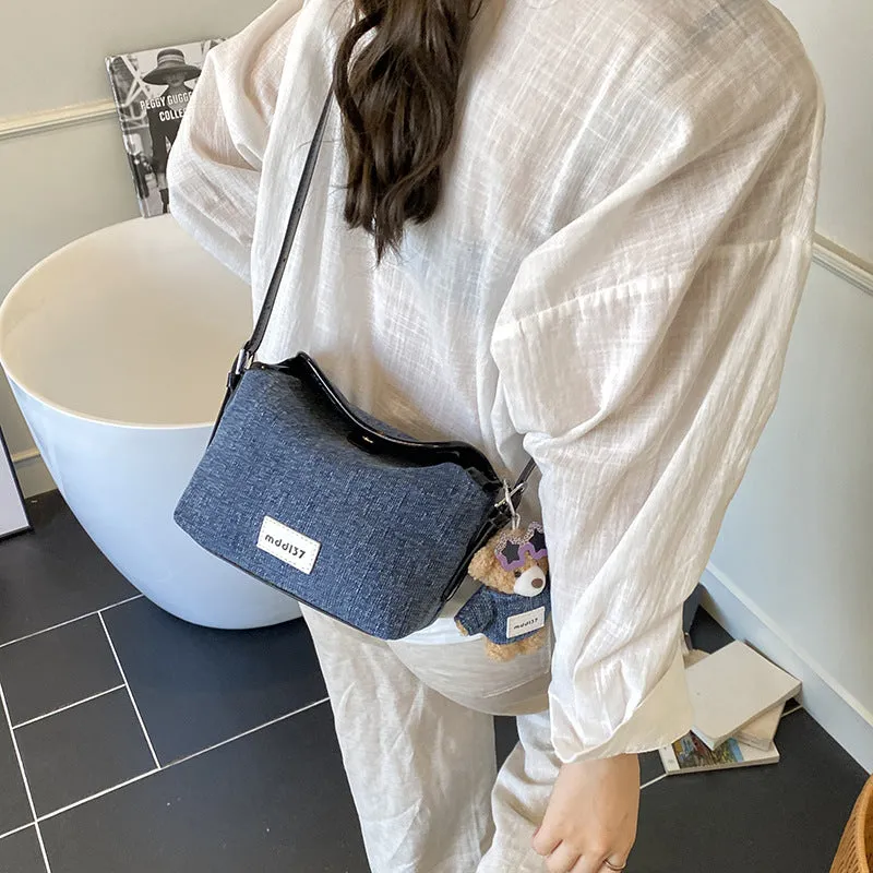 Fashion retro denim small crossbody bag in black with slit pocket and pendant