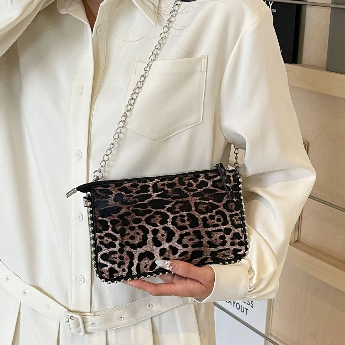 Women's square crossbody bag in PU leather with chain detail, shown in dark brown colour