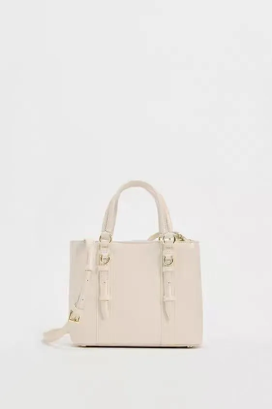 Women's olive green mini city messenger bag in PU leather with single shoulder strap and horizontal square shape