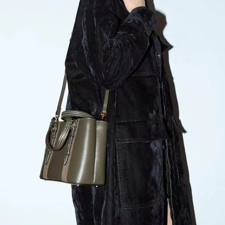 Women's olive green mini city messenger bag in PU leather with single shoulder strap and horizontal square shape