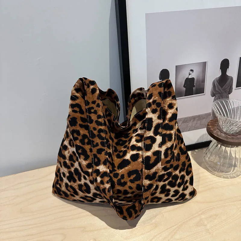 Leopard print shoulder messenger bag with square vertical shape and single strap, available in black, brown, and pink
