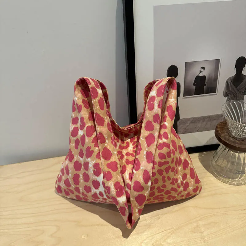 Leopard print shoulder messenger bag with square vertical shape and single strap, available in black, brown, and pink